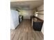 Galley kitchen with wood cabinets and tile floor at 7027 Hawkins Rd, Sarasota, FL 34241