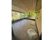 Screened porch with tiled floor at 7027 Hawkins Rd, Sarasota, FL 34241