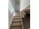 Carpeted staircase leading to upper level at 7027 Hawkins Rd, Sarasota, FL 34241