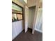 Small storage closet with louvered doors at 7027 Hawkins Rd, Sarasota, FL 34241