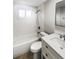 Updated bathroom with white subway tile and a quartz vanity at 9640 Mark Twain Ln, Port Richey, FL 34668