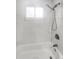 Clean bathroom with subway tile and a shower/tub combo at 9640 Mark Twain Ln, Port Richey, FL 34668