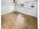 Spacious living room featuring light wood floors at 9640 Mark Twain Ln, Port Richey, FL 34668