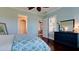 Spacious bedroom with wood floors and a view of the living room at 4777 Royal Dornoch Cir, Bradenton, FL 34211