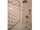 Bathroom detail featuring gold fixtures and geometric tile at 10922 Subtle Trail Dr, Riverview, FL 33579