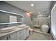 Elegant bathroom with double vanity, soaking tub, and walk-in shower at 10922 Subtle Trail Dr, Riverview, FL 33579