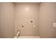 Laundry room with hookups and built-in shelving at 10922 Subtle Trail Dr, Riverview, FL 33579