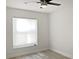 Bright bedroom with large window and ceiling fan at 2321 E Del Webb Blvd, Sun City Center, FL 33573