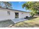 Home's backyard with patio and partial fence at 27111 Wakefield Dr, Brooksville, FL 34602