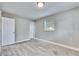 Simple bedroom with grey walls, carpet, and white door at 27111 Wakefield Dr, Brooksville, FL 34602