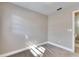 Well-lit bedroom featuring grey walls and carpet flooring at 27111 Wakefield Dr, Brooksville, FL 34602