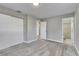 Main bedroom with gray walls, carpet flooring, and en-suite bathroom access at 27111 Wakefield Dr, Brooksville, FL 34602