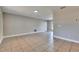 Spacious living room with tile floors and access to backyard at 27111 Wakefield Dr, Brooksville, FL 34602