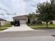 One-story home with attached garage and landscaped yard at 13642 Newport Shores Dr, Hudson, FL 34669