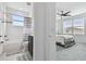 Stylish bathroom with tub, shower, and black and white striped curtain at 3135 Great Banyan Way, Wesley Chapel, FL 33543