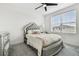 Elegant bedroom with silver bed frame, fluffy rug, and large window at 3135 Great Banyan Way, Wesley Chapel, FL 33543