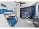 bedroom with bunk beds, a desk, and space themed decor at 3135 Great Banyan Way, Wesley Chapel, FL 33543