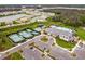 Aerial view of community center with pool and courts at 3135 Great Banyan Way, Wesley Chapel, FL 33543