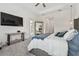 Main bedroom with large TV, full bed and access to patio at 3135 Great Banyan Way, Wesley Chapel, FL 33543