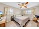 Spacious bedroom with ceiling fan and ample closet space at 37337 Orange Row Ln, Dade City, FL 33525