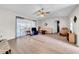 Living Room with laminate flooring and sliding doors to patio at 37337 Orange Row Ln, Dade City, FL 33525