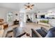 Bright living room featuring hardwood floors and a fireplace at 37337 Orange Row Ln, Dade City, FL 33525