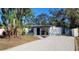 Updated home exterior boasts a modern design and landscaped yard at 231 W Cornelius Cir, Sarasota, FL 34232