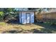 White shed with black trim in the backyard at 231 W Cornelius Cir, Sarasota, FL 34232