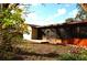 Home's back features a screened porch and deck at 802 Gateway Ln, Tampa, FL 33613