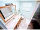 Bright bathroom featuring a tub with shower, toilet, and vanity with a mirror at 802 Gateway Ln, Tampa, FL 33613