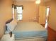 Well-lit bedroom with a comfortable bed and access to an outdoor space at 802 Gateway Ln, Tampa, FL 33613