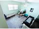 Bedroom with carpeted floor, ceiling fan, and a bed and desk near a large window at 802 Gateway Ln, Tampa, FL 33613