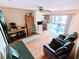 Spacious living room offering ample seating, an office area and access to a balcony at 802 Gateway Ln, Tampa, FL 33613