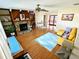 Comfortable living room with a stone fireplace, wood floors, and a beamed ceiling at 802 Gateway Ln, Tampa, FL 33613