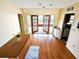 Cozy living room with wood floors and French doors leading to an outdoor area at 802 Gateway Ln, Tampa, FL 33613