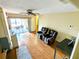 Inviting living room with wood floors and sliding glass doors leading to an outdoor patio at 802 Gateway Ln, Tampa, FL 33613