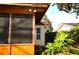 Wooden screened porch with exterior lighting at 802 Gateway Ln, Tampa, FL 33613