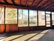 Relaxing screened porch with wooden accents offering a seamless transition to the outdoors at 802 Gateway Ln, Tampa, FL 33613