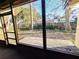 View from screened in porch to backyard and deck at 802 Gateway Ln, Tampa, FL 33613