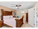 Comfortable bedroom with king bed, ceiling fan and en-suite bathroom at 18004 Tarrington Pl, Hudson, FL 34667