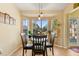 Bright breakfast nook with table and chairs, overlooking backyard at 18004 Tarrington Pl, Hudson, FL 34667