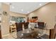 Spacious dining room with a glass-top table and six chairs at 18004 Tarrington Pl, Hudson, FL 34667