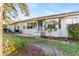 Rear exterior view, showing patio and landscaping at 18004 Tarrington Pl, Hudson, FL 34667
