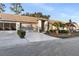Front view of home showcasing garage and driveway at 18004 Tarrington Pl, Hudson, FL 34667
