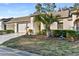 Side view of home highlighting landscaping and garage at 18004 Tarrington Pl, Hudson, FL 34667
