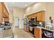 Modern kitchen with stainless steel appliances and granite countertops at 18004 Tarrington Pl, Hudson, FL 34667