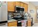 Kitchen boasts stainless steel appliances and granite countertops at 18004 Tarrington Pl, Hudson, FL 34667