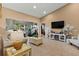 Living room with vaulted ceilings and large windows offering a view at 18004 Tarrington Pl, Hudson, FL 34667