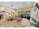 Open living room with view into kitchen and backyard at 18004 Tarrington Pl, Hudson, FL 34667