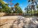 Large backyard with a paved area and wooden fence at 3030 46Th W Ave, Bradenton, FL 34207